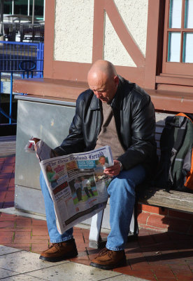Catching up with the News on Queen Street.jpg
