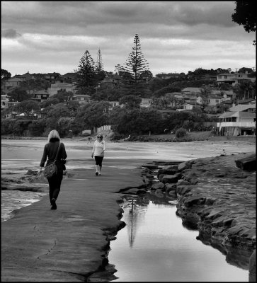 Busy walkway under the cliff