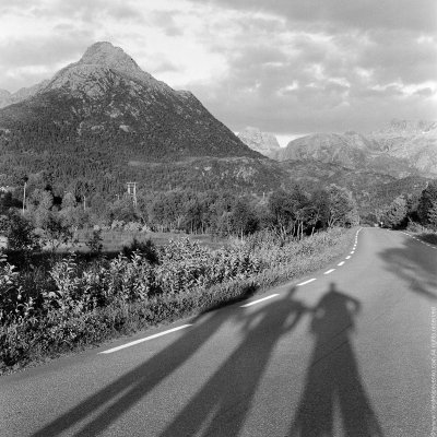 Our shadows on the road at Lofoten Islands