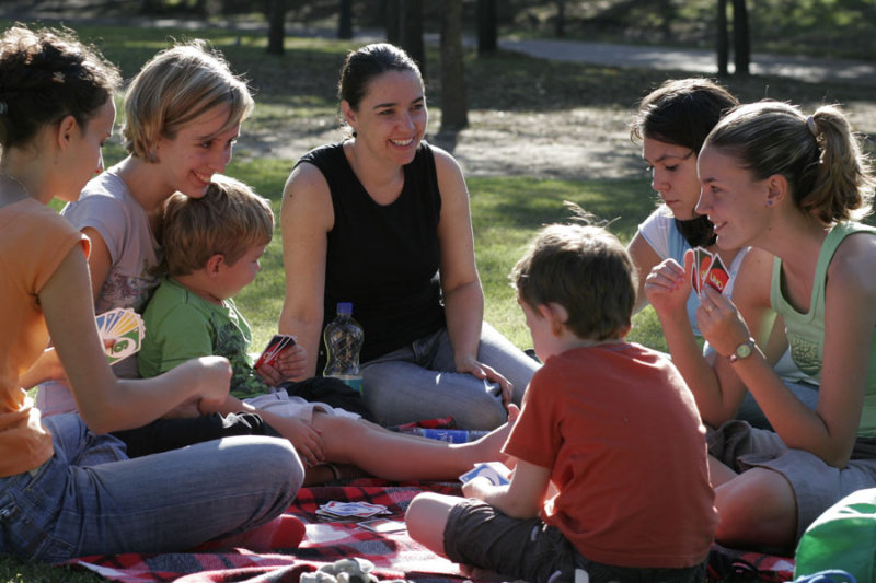 Kylie and the boys with the youth group playing Uno.