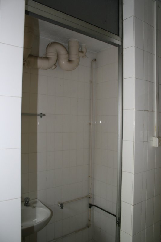 Before: Downstairs bathroom in kitchen