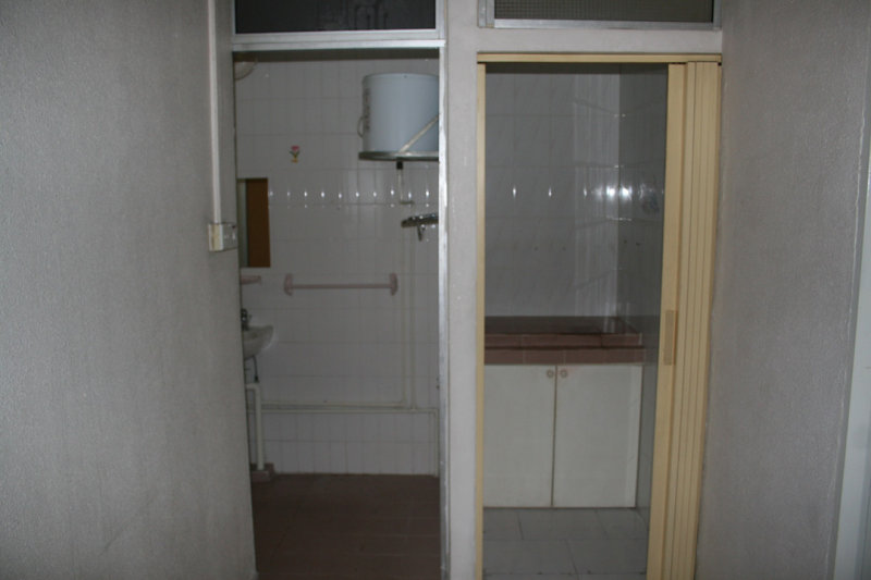 Before: Looking into second bath and prayer room from upstairs landing