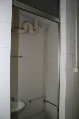 Before: Downstairs bathroom in kitchen