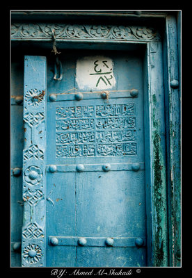 Blue door with welcoming message