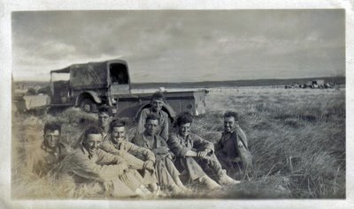 Sgt. Richard Glenn in field with Buddies