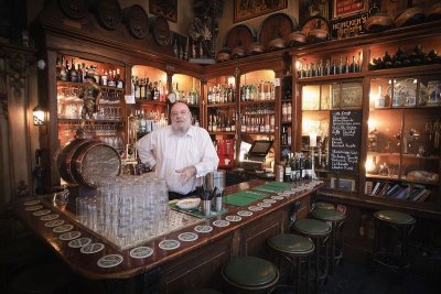 Retired bartender Jaecques André still 'fills in' at the old Amsterdam bar where he worked for years