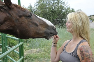 Nancy Woodland feeding a neighbors horse _DSC2568.jpg