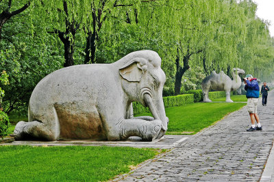 25_A_stone_kneeling_elephant.jpg