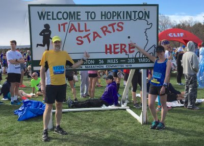 In front a replica of the famous It All Starts Here sign in Hopkinton