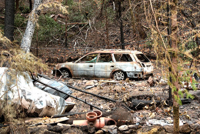 Burned out car and ruins Adobe Canyon
