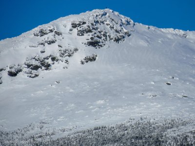 Hiker on the summit of Mt. Monroe