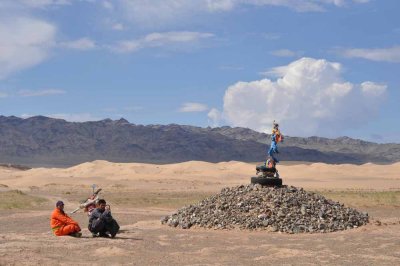 Herdsmen resting at Buddhist shrine in Gobi