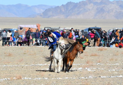 Buzkashi game - tug of war using goat skin