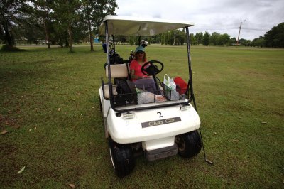 Playing golf in Hat Yai, Thailand. Reeta was the driver