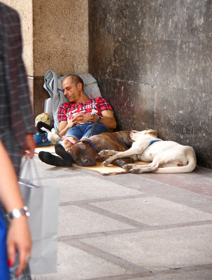 Luxury and poverty. Corso Vittorio Emanuele, Piazza Duomo,Milano