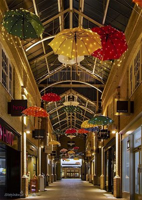 Hanging brollies in Canterbury shopping arcade