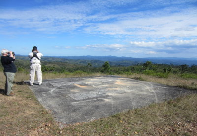 Marilyn and Eric look for soaring raptors near an old helicopter landing pad. 