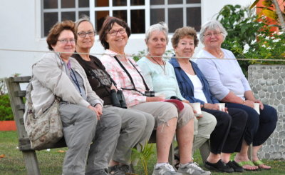 Mary, Donna, Jane, Gretta, Betty and Marilyn
share a shore-view bench at the end of the day
at Bird's Eye View Resort, Crooked Tree, Belize, C.A.