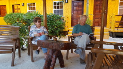 Betty and Steve relax in the shade of the patio
at Seaside Cabanas before our afternoon walk.
Looks like Steve may be studying his Birds of Belize field guide.