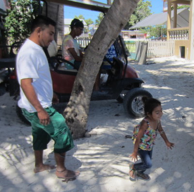 This little girl was entertaining us on the beach
while we were waiting to take our baggage to the ferry station.