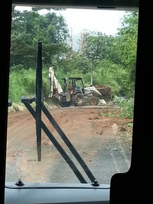 Front-end loader clearing the road around Lake Arenal; we continued after a few minutes.