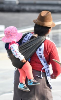 Woman in traditional attire with an infant