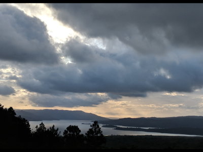 The clouds roll in over Lake Arenal Friday evening, April 20, 2018