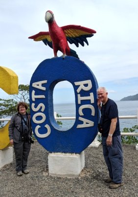Mary and Steve at the sign for Jaco, Costa Rica