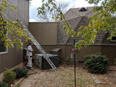 Paul putting on the last of the paint on the replaced siding