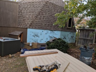 Panels in foreground before being cut and applied to house