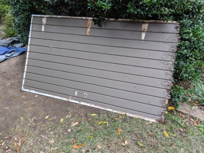 They removed the old door to the shed to replace the exterior panel that had rotted at the bottom because I had put metal trim on that collected water.