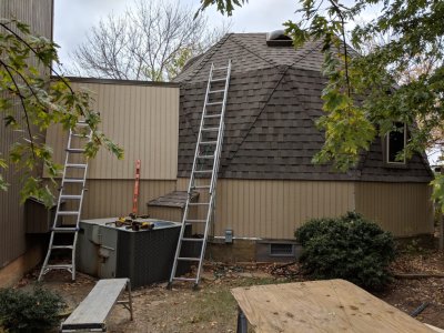 New siding, sans trim, on the east side of the small dome