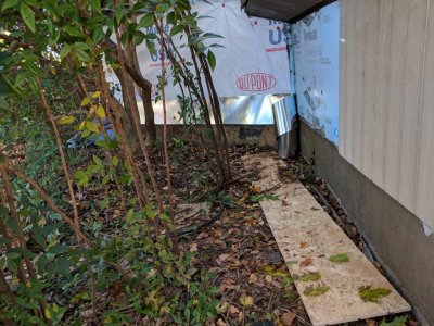 They put flashing under the siding and over the concrete.