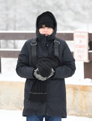 Jan used her scarf to protect her camera.