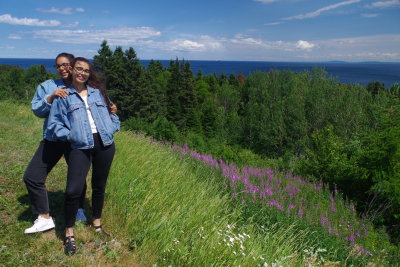 Johanna and Christina and the St. Lawrence River, complimented by fireweed (Epilobium angustifolium)