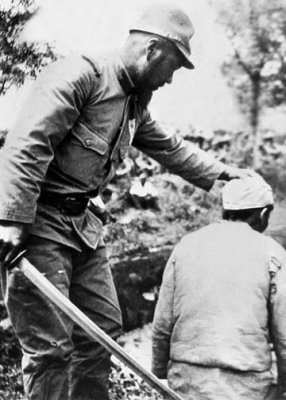 Japanese soldier preparing to behead a Chinese prisoner