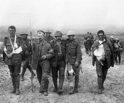 19 July 1916 - German prisoner helping British wounded to a dressing station