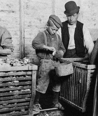 March 1911 - 9 year old Johnnie shucking oysters