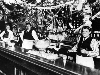 1915 - Babe Ruth (center) tending bar with his father (right)