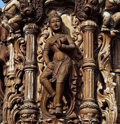 Dancing deity in carved wood