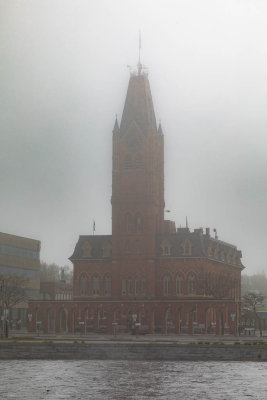 Belleville City Hall in fog across the Moira River