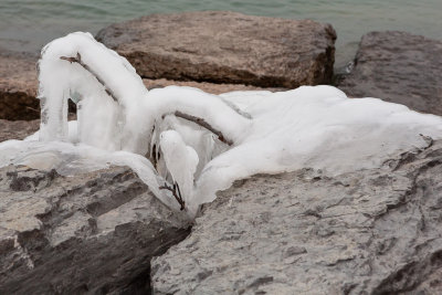 Ice on the rocks that lead to the Wellington Lighthouse on Lake Ontario.
