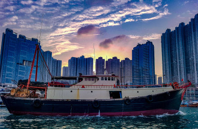 Trawler returns to the Typhoon Shelter at sunset