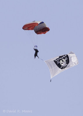 Parachuting into the Coliseum at a Raiders game.