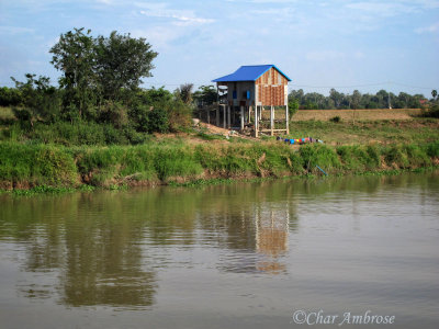 Lone House on the River's Edge