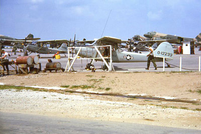 Spotter Aircraft with C-47 gunships in the background