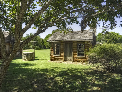 Settlers cabin with well