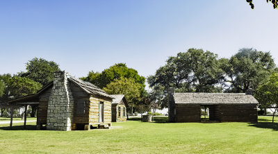 Long shot of cabins with dog trot house
