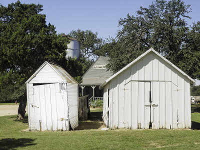 Old storage buildings with cistern in background