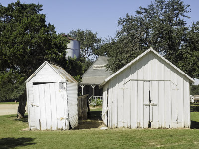 Old storage buildings with cistern in background